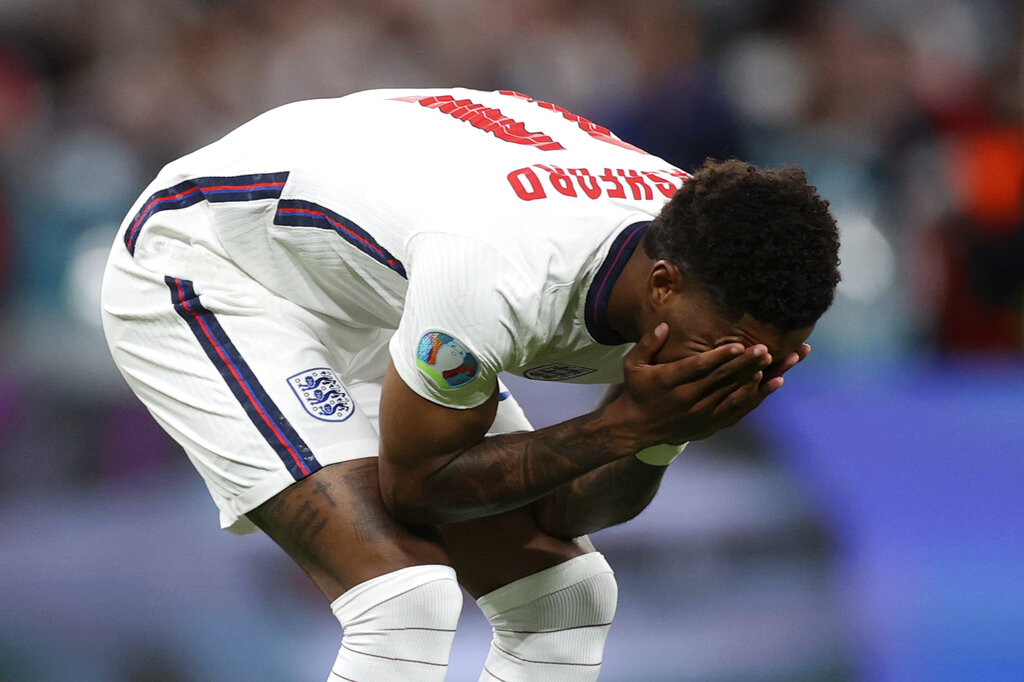 England's Marcus Rashford reacts after failing to score a penalty during a shootout at the end of the Euro 2020 soccer championship final match between England and Italy at Wembley stadium in London, Sunday, July 11, 2021. (Carl Recine/Pool Photo via AP)