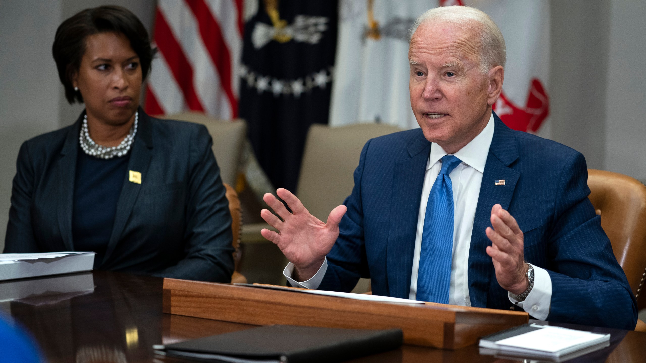 Washington Mayor Muriel Bowser listens as President Joe Biden speaks during a meeting on reducing gun violence, in the Roosevelt Room of the White House, Monday, July 12, 2021, in Washington. (AP Photo/Evan Vucci)