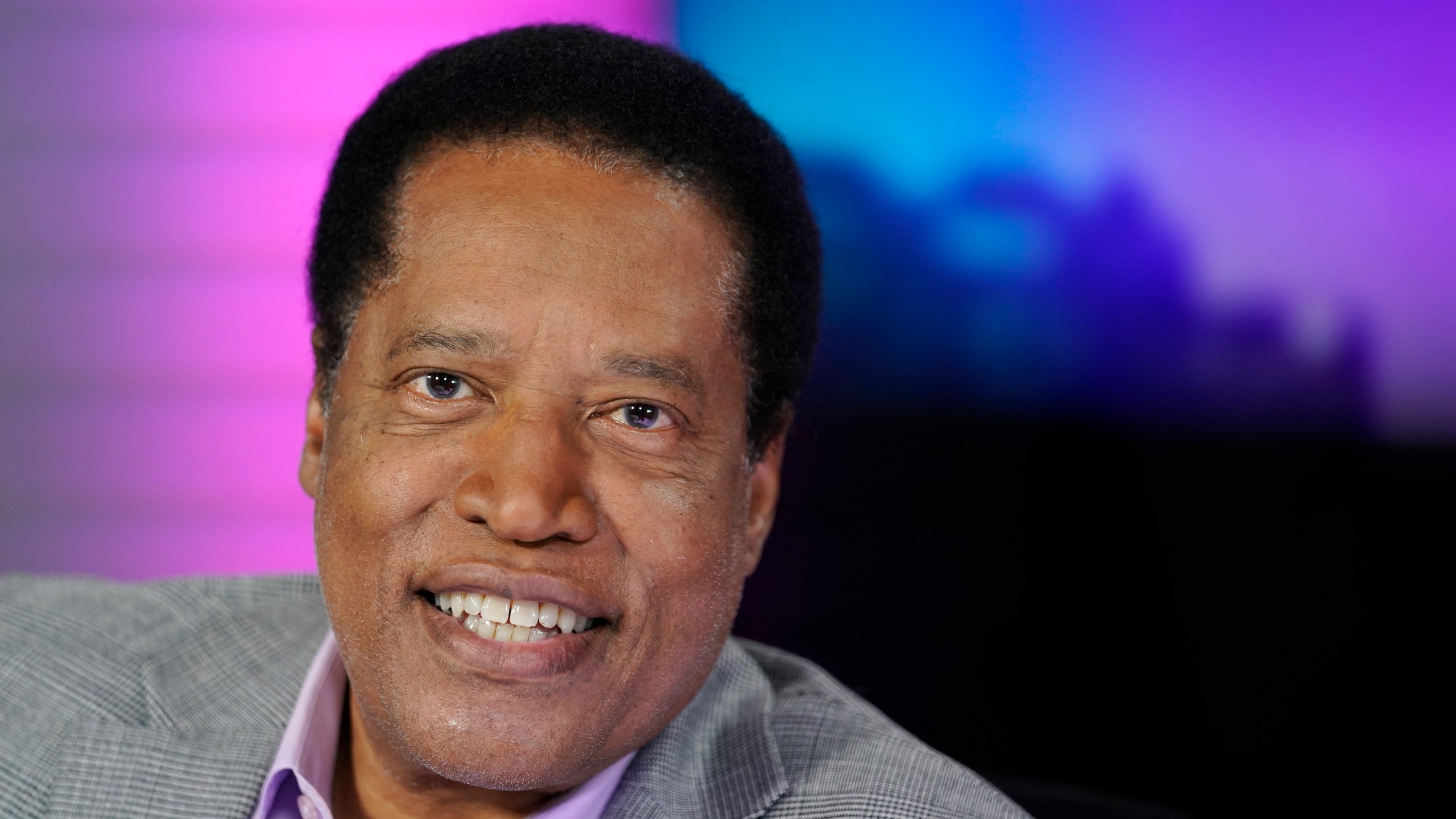 Radio talk show host Larry Elder poses for a photo in his studio, Monday, July 12, 2021, in Burbank, Calif. Elder has announced he is running for governor of California. (AP Photo/Marcio Jose Sanchez)