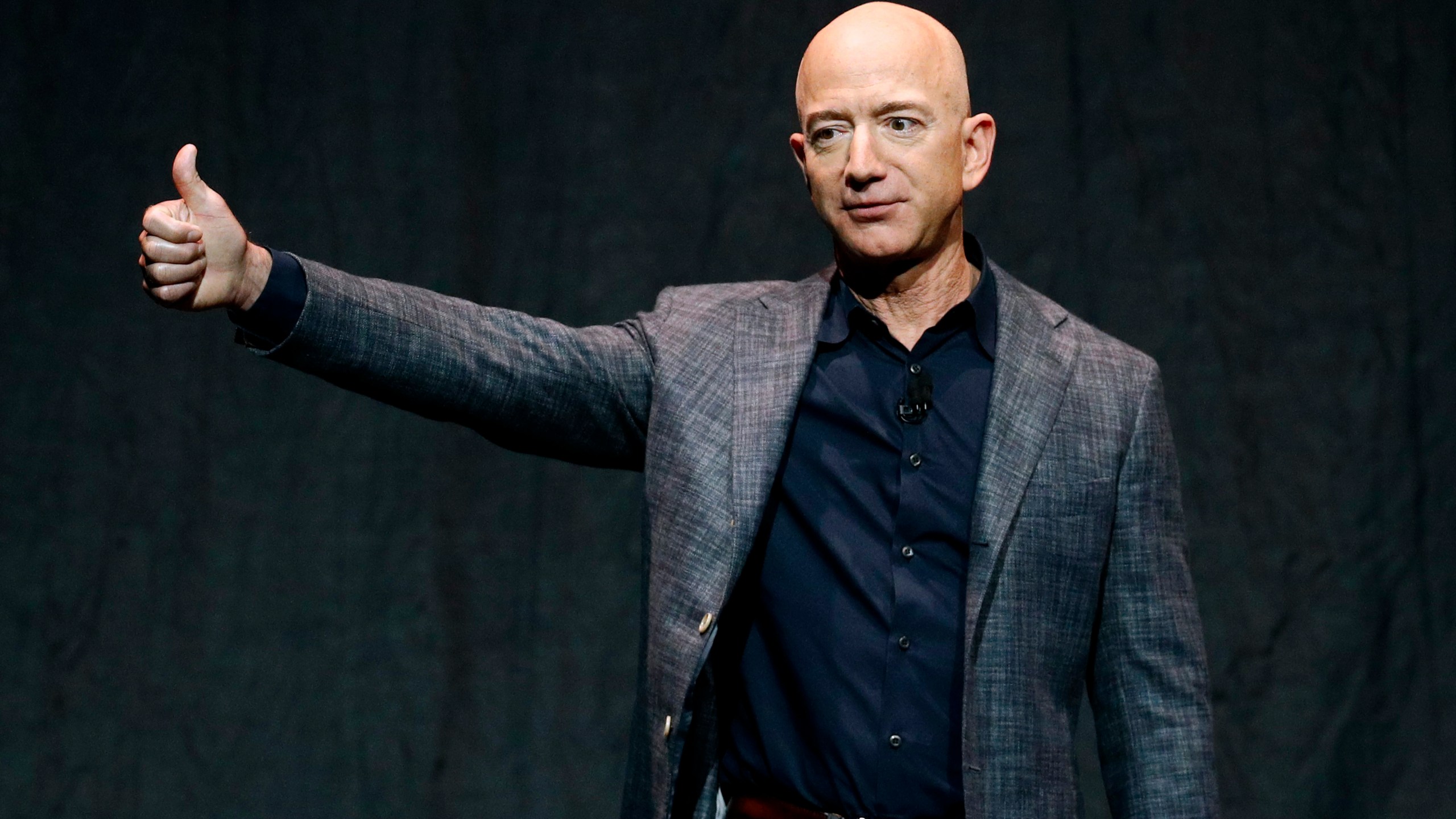 In this Thursday, May 9, 2019, file photo, Jeff Bezos speaks at an event before unveiling Blue Origin's Blue Moon lunar lander, in Washington. On Monday, July 12, 2021, the Federal Aviation Administration approved Blue Origin's attempt to launch people into space. (AP Photo/Patrick Semansky, File)