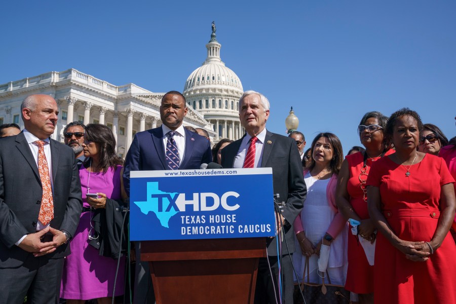 Rep. Marc Veasey, D-Texas, center left, and Rep. Lloyd Doggett, D-Texas, joined at left by Rep. Chris Turner, chairman of the Texas House Democratic Caucus, welcome Democratic members of the Texas legislature at a news conference at the Capitol in Washington, Tuesday, July 13, 2021. The lawmakers left Austin hoping to deprive the Texas Legislature of a quorum — the minimum number of representatives who have to be present for the body to operate, as they try to kill a Republican bill making it harder to vote in the Lone Star State. (AP Photo/J. Scott Applewhite)