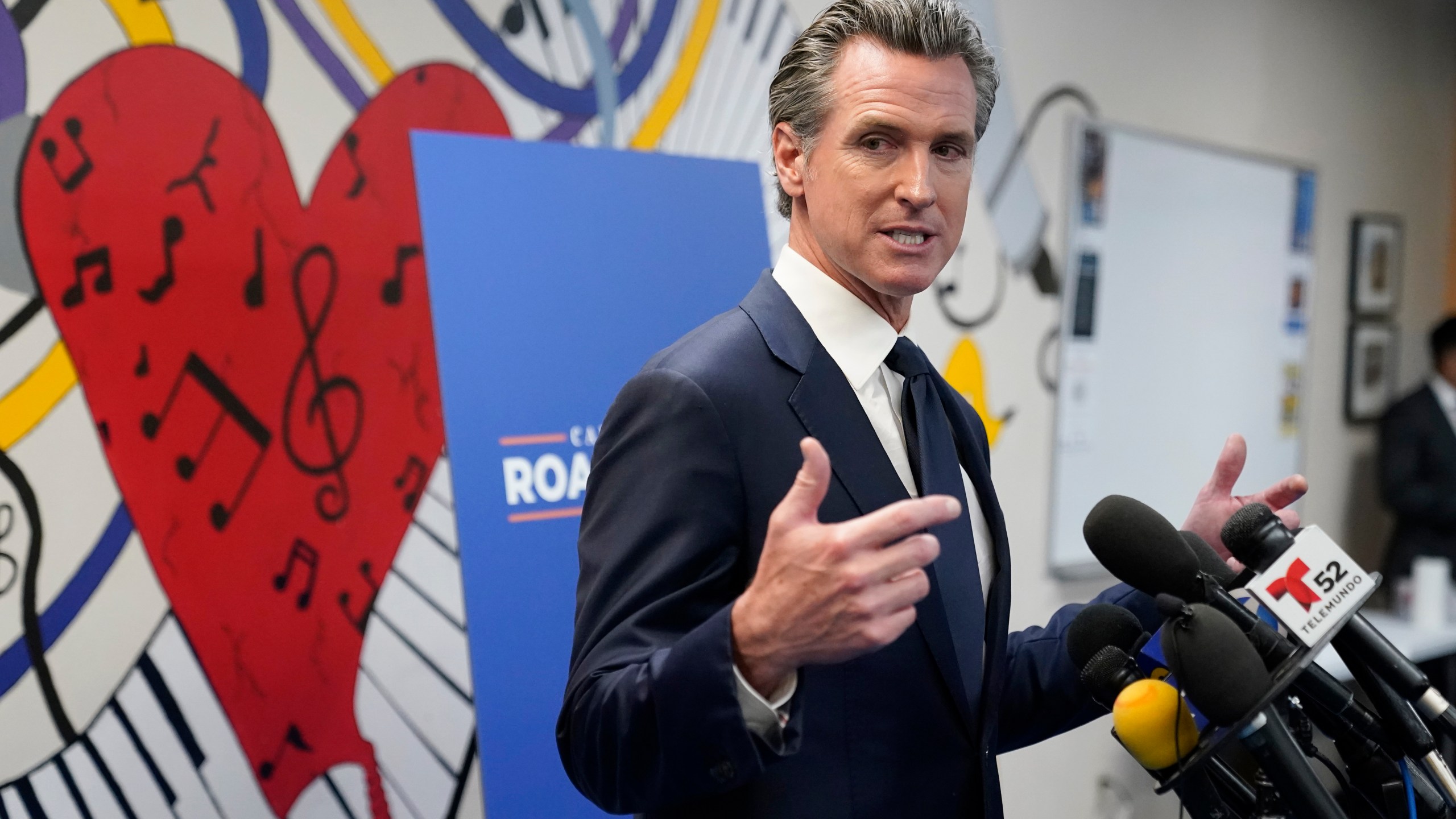 California Gov. Gavin Newsom fields questions after a rally where he signed the California Comeback Plan relief bill Tuesday, July 13, 2021, in Los Angeles. (AP Photo/Marcio Jose Sanchez)