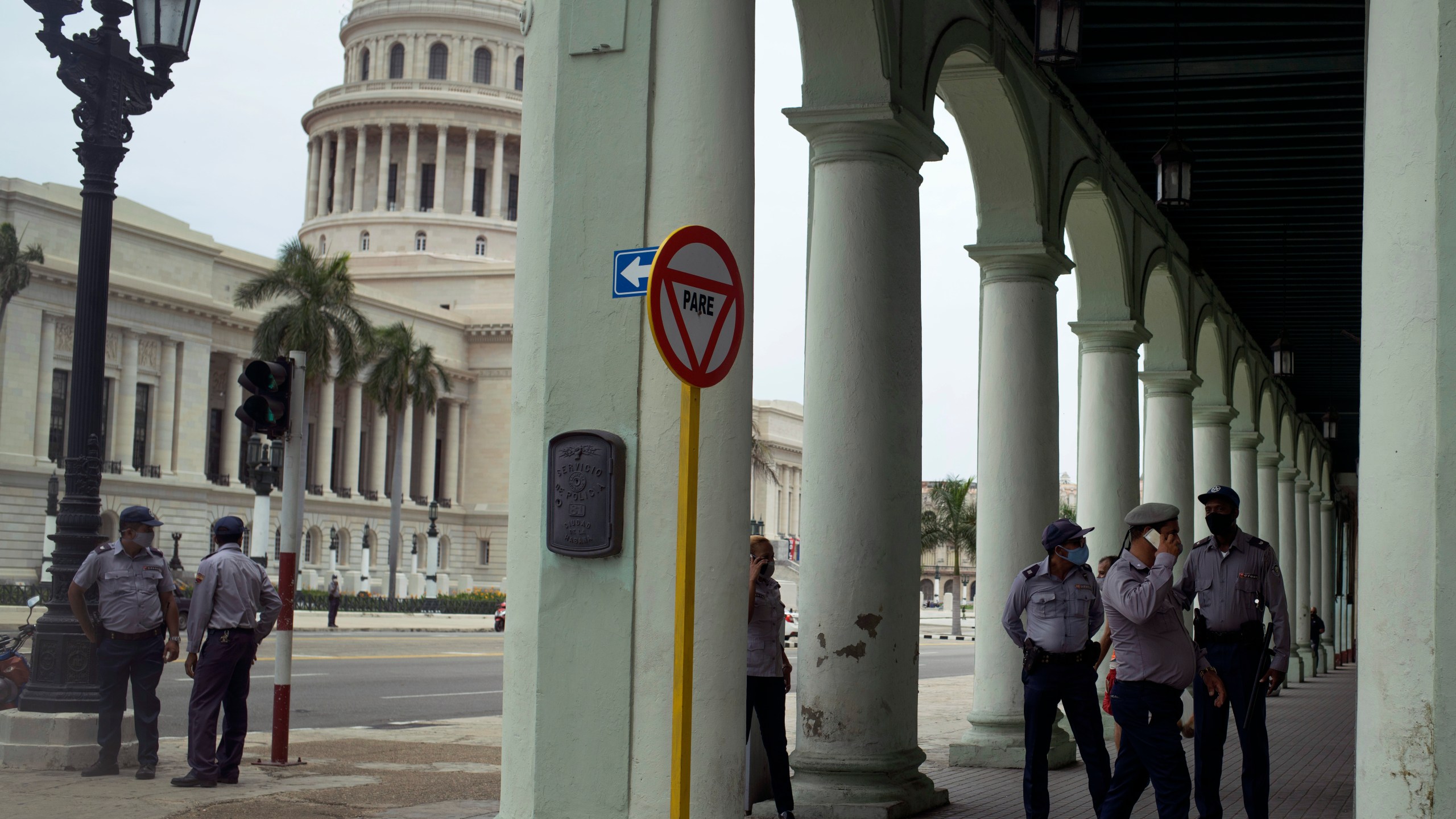 Police stand guard near the National Capitol building in Havana, Cuba, Wednesday, July 14, 2021, days after protests. Demonstrators voiced grievances on Sunday against goods shortages, rising prices and power cuts, and some called for a change of government. (AP Photo/Eliana Aponte)