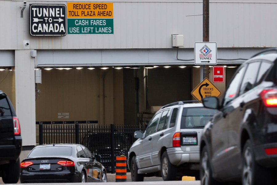 In this March 16, 2020, file photo, vehicles enter the Detroit-Windsor Tunnel in Detroit to travel to Canada. (Paul Sancya/Associated Press)