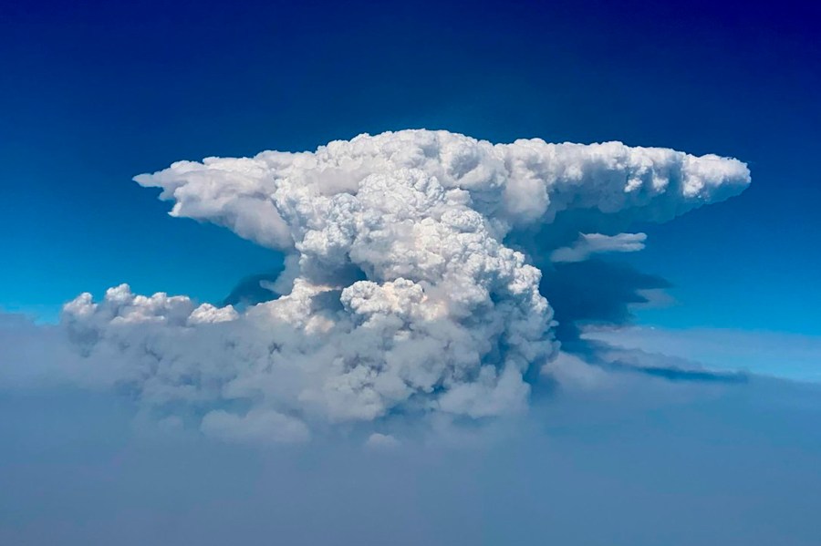 In this photo taken with a drone provided by the Bootleg Fire Incident Command, a pyrocumulus cloud, also known as a fire cloud, is seen over the Bootleg Fire in southern Oregon on July 14, 2021. (Bootleg Fire Incident Command via AP)