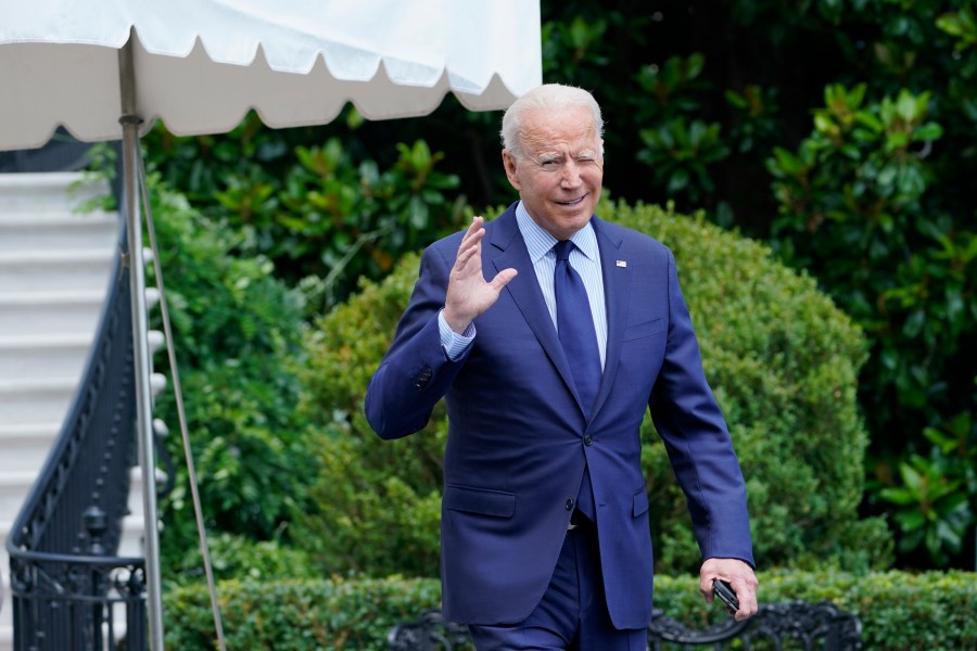 President Joe Biden tries to hear questions shouted by reporters as he heads to Marine One on the South Lawn of the White House in Washington, Friday, July 16, 2021, to spend the weekend at Camp David. (AP Photo/Susan Walsh)