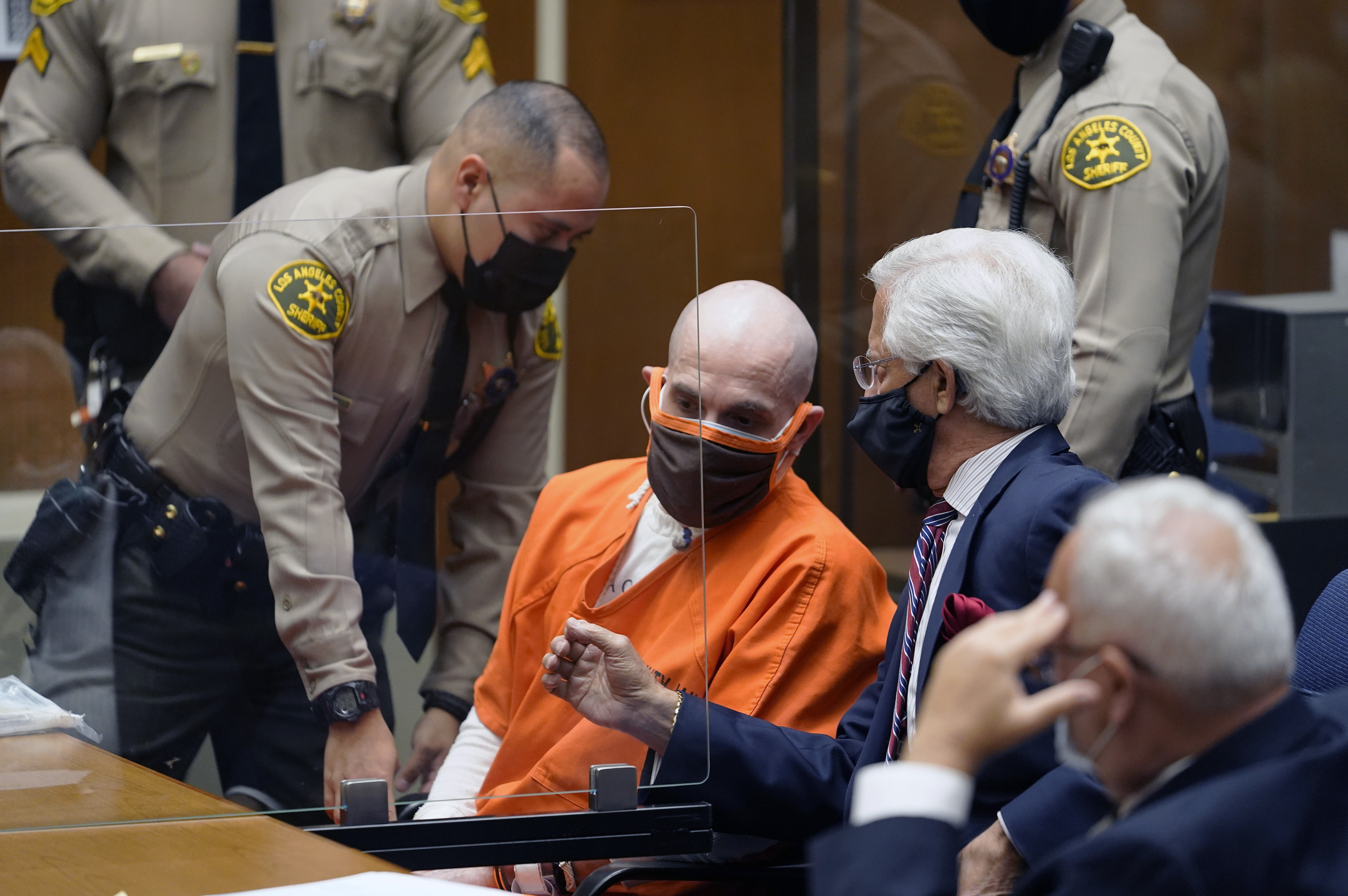 Michael Thomas Gargiulo, left, listens to his defense attorneys, Daniel Nardoni, middle, and Dale Michael Rubin during a sentencing hearing at Los Angeles Superior Court, Friday, July 16, 2021. A judge denied a new trial for Garigiulo, a man prosecutors called “The Boy Next Door Killer,” who could be sentenced to death later Friday for the home-invasion murders of two women and the attempted murder of a third. (AP Photo/Damian Dovarganes)