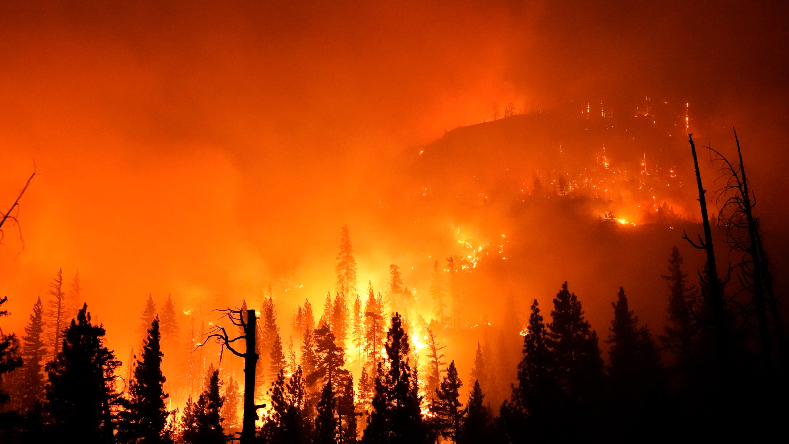 In this Sept. 6, 2020, file photo, the Creek Fire burns in the Sierra National Forest near Big Creek, Calif. (AP Photo/Marcio Jose Sanchez, File)