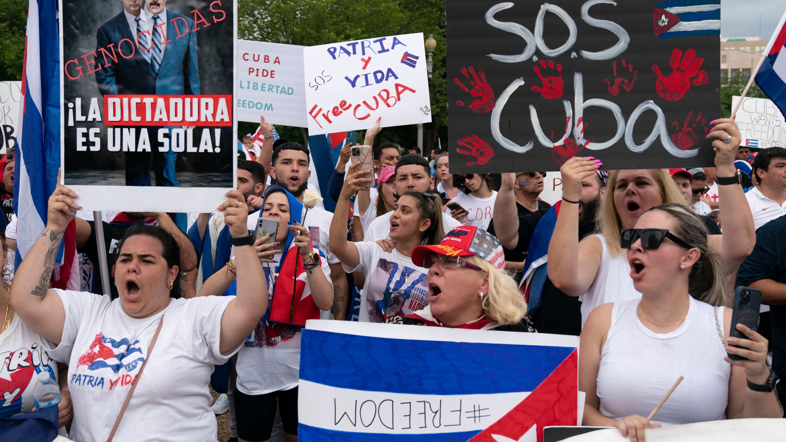 Demonstrators shout their solidarity with the Cuban people against the communist government during a rally outside the White House in Washington, Saturday, July 17, 2021.(AP Photo/Jose Luis Magana)