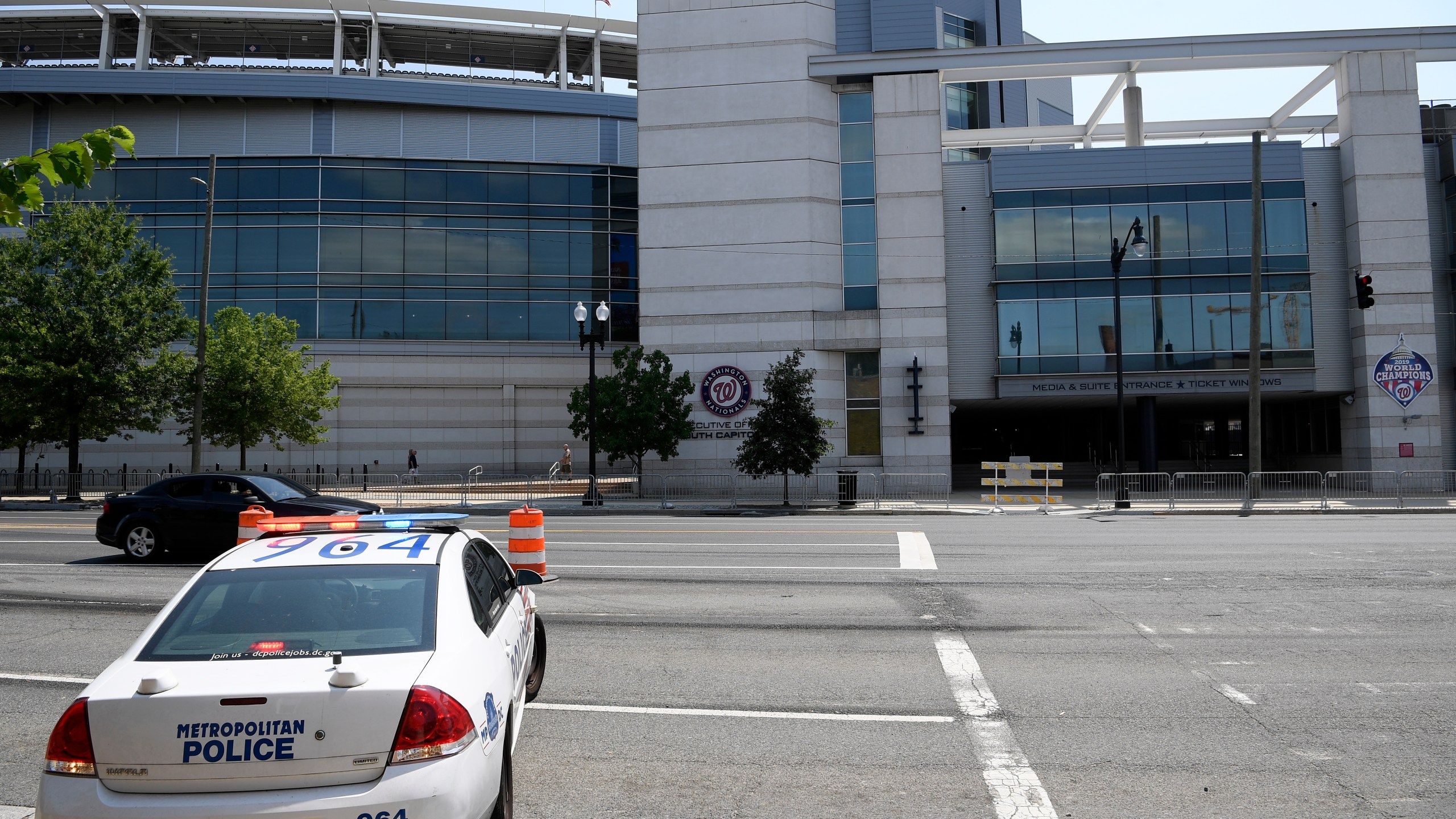 A police car is seen across from Nationals Park, Sunday, July 18, 2021, in Washington. (AP Photo/Nick Wass)