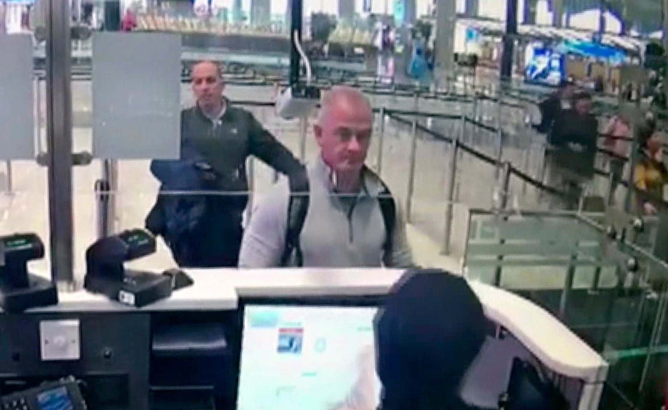 This Dec. 30, 2019, image from security camera video shows Michael L. Taylor, center, and George-Antoine Zayek at passport control at Istanbul Airport in Turkey. A Tokyo court handed down prison terms for the American father Michael Taylor and son Peter accused of helping Nissan’s former chairman, Carlos Ghosn, escape to Lebanon while awaiting trial in Japan.(DHA via AP, File)