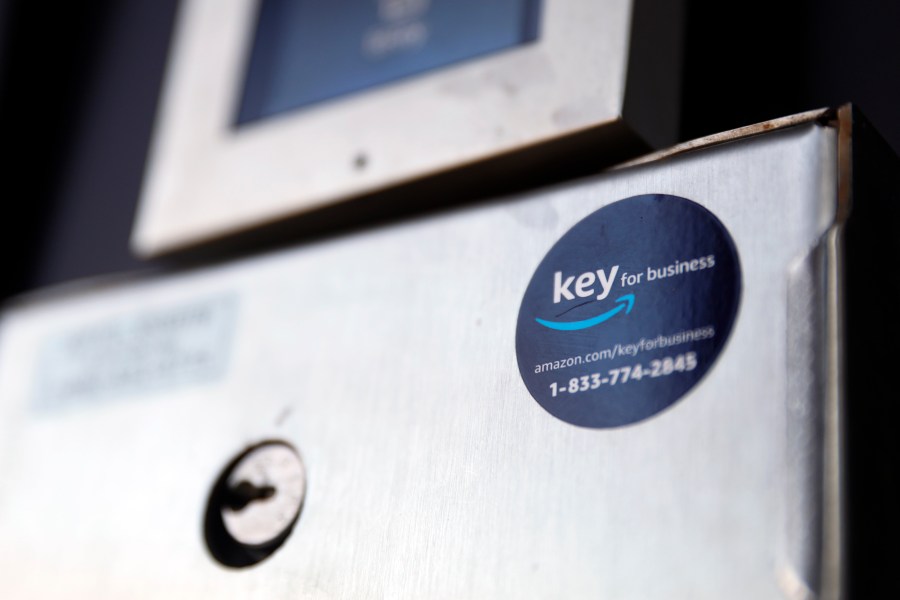 A blue sticker with the Amazon logo is displayed on a buzzer system in the apartment building of Jason Goldberg, chief commerce strategy officer at marketing company Publicis Communications, Monday, March 29, 2021, in Chicago. (AP Photo/Shafkat Anowar)