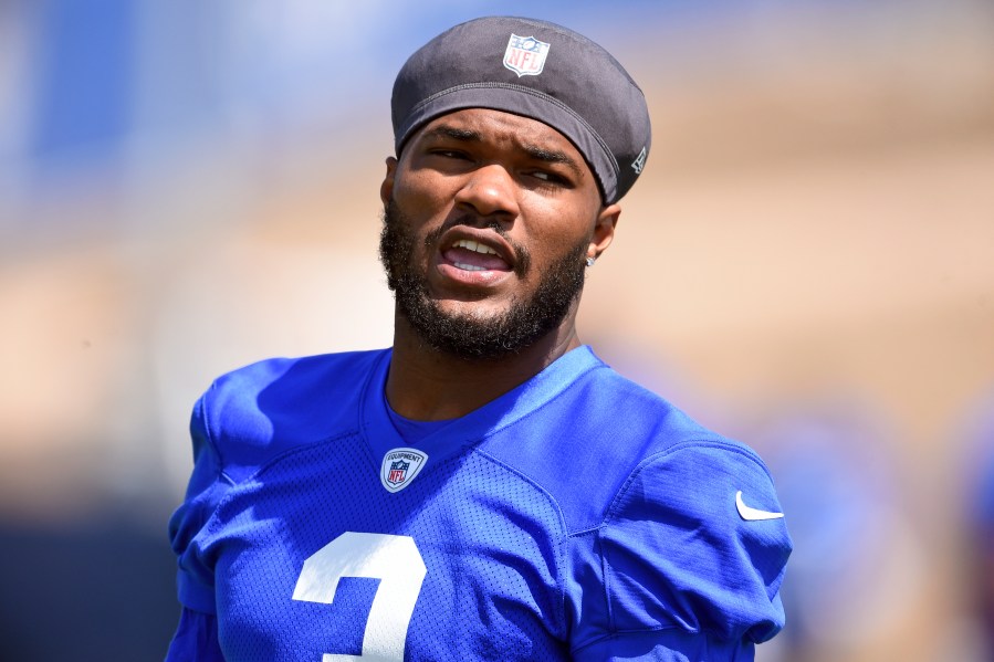 In this May 27, 2021, file photo, Los Angeles Rams' Cam Akers warms up during NFL football practice in Thousand Oaks, Calif. Akers is out indefinitely after tearing his Achilles tendon in an offseason training session. The Rams confirmed the injury Tuesday, July 20, 2021, one week before veterans report to training camp. (AP Photo/Kelvin Kuo, File)