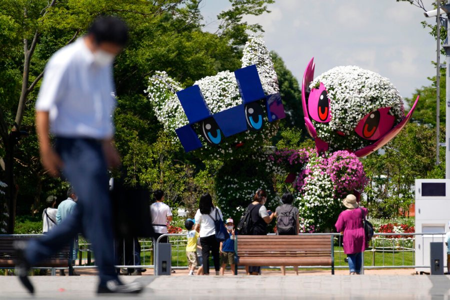 Large topiary of Miraitowa, the official mascot of Tokyo 2020 Olympics and Someity, the official mascot of Paralympics, are displayed at a Symbol Promenade Park Flower Plaza Wednesday, July 21, 2021, in Tokyo. (AP Photo/Kiichiro Sato)