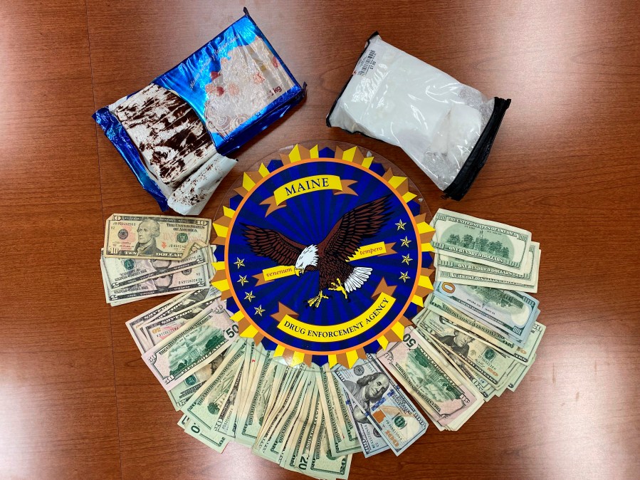 This undated photo provided by the Maine Drug Enforcement Agency shows a marble cake which contained about 2 pounds of cocaine, and cash, seized from a vehicle in Gardiner, Maine. A New York man and a Maine woman are facing charges, Wednesday, July 21, 2021, after the cocaine disguised as a cake was seized from their vehicle, authorities said. (Maine Drug Enforcement Agency via AP)