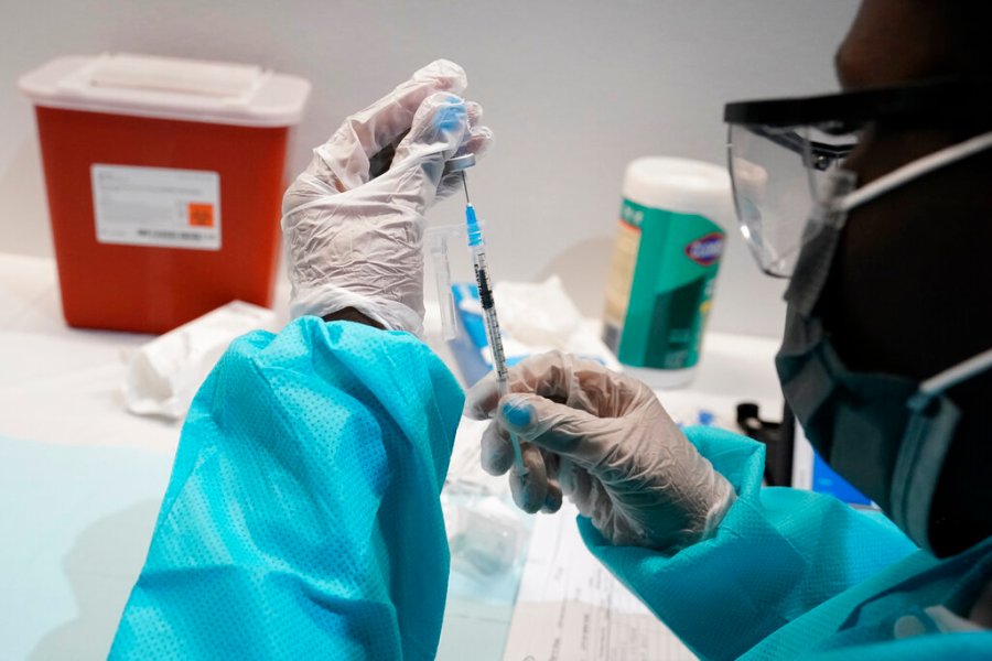 In this July 22, 2021, file photo, a health care worker fills a syringe with the Pfizer COVID-19 vaccine at the American Museum of Natural History in New York. (AP Photo/Mary Altaffer, File)