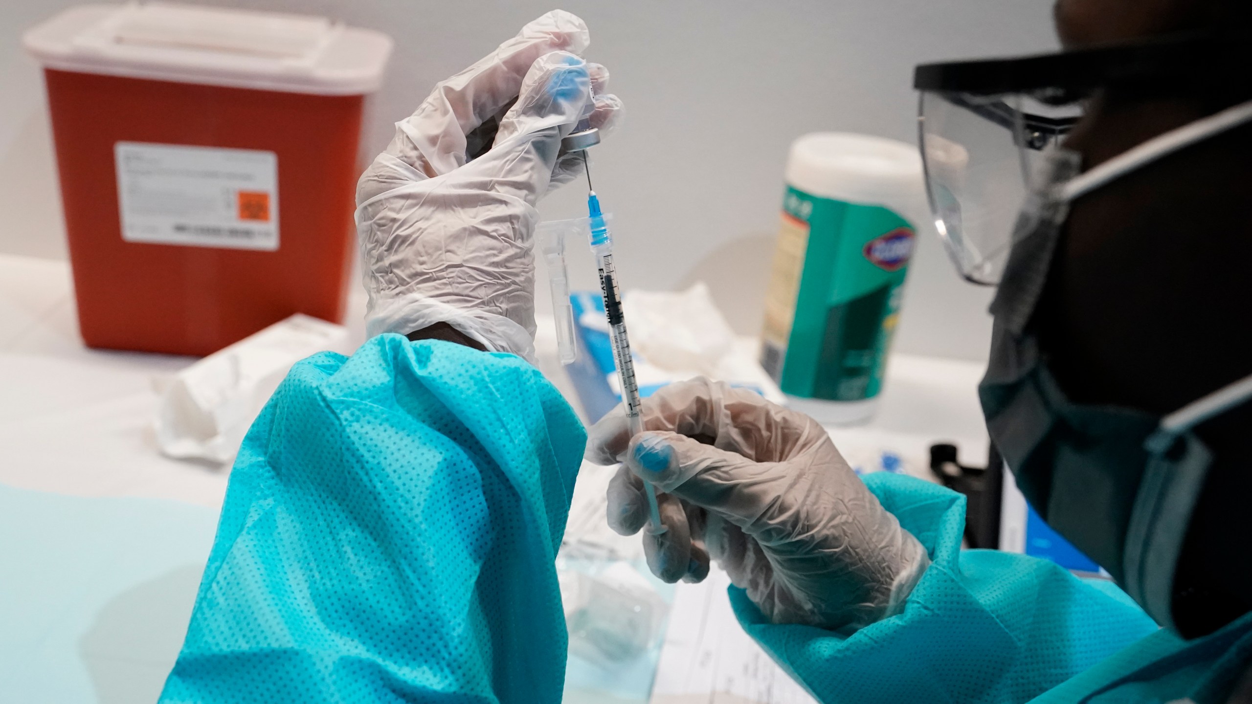 A health care worker fills a syringe with the Pfizer COVID-19 vaccine, Thursday, July 22, 2021, at the American Museum of Natural History in New York. (AP Photo/Mary Altaffer, File)