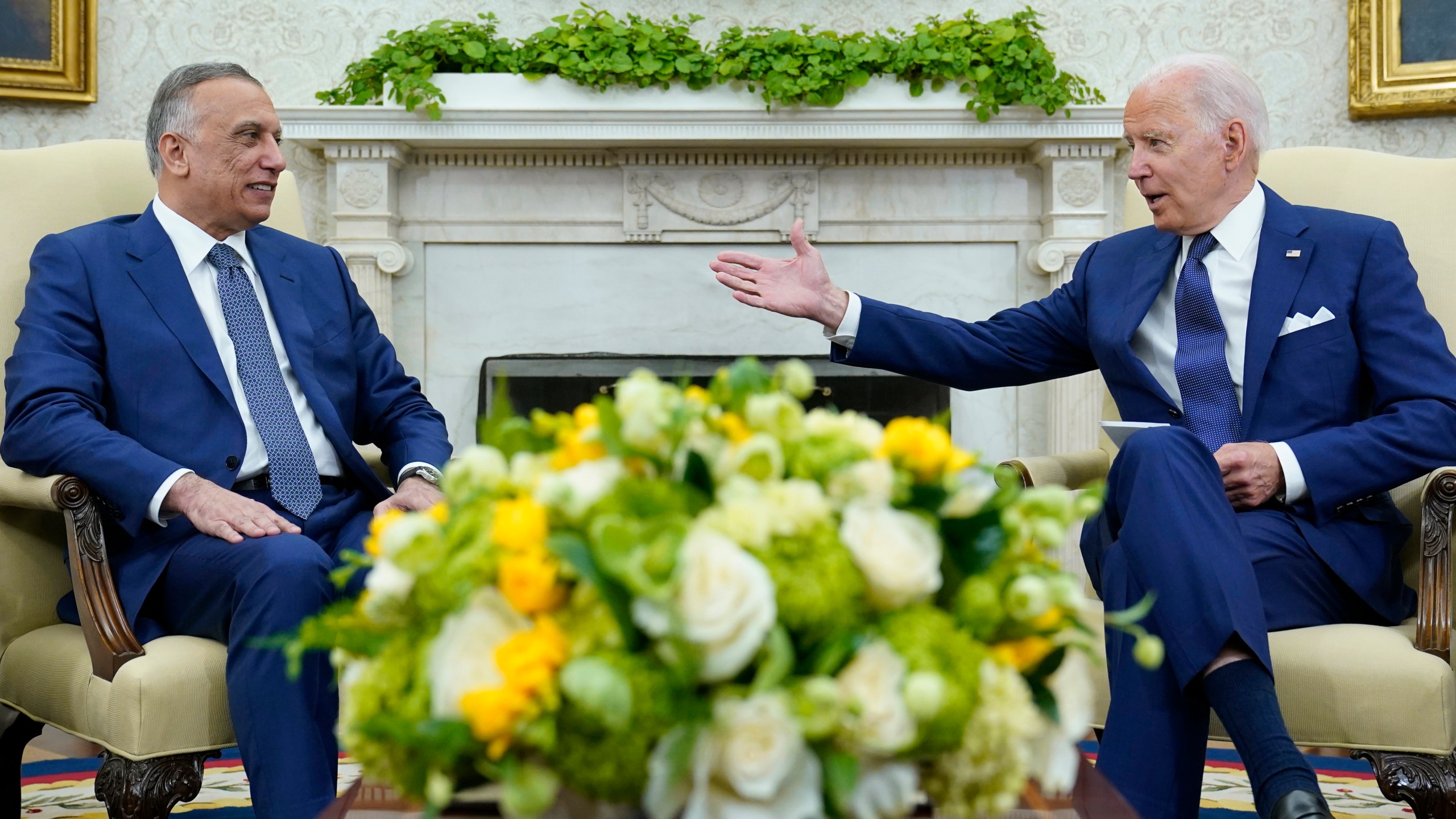 President Joe Biden, right, speaks as Iraqi Prime Minister Mustafa al-Kadhimi, left, listens during their meeting in the Oval Office of the White House in Washington on July 26, 2021. (AP Photo/Susan Walsh)