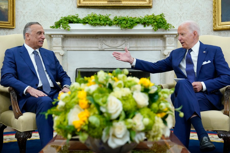 President Joe Biden, right, speaks as Iraqi Prime Minister Mustafa al-Kadhimi, left, listens during their meeting in the Oval Office of the White House in Washington on July 26, 2021. (AP Photo/Susan Walsh)