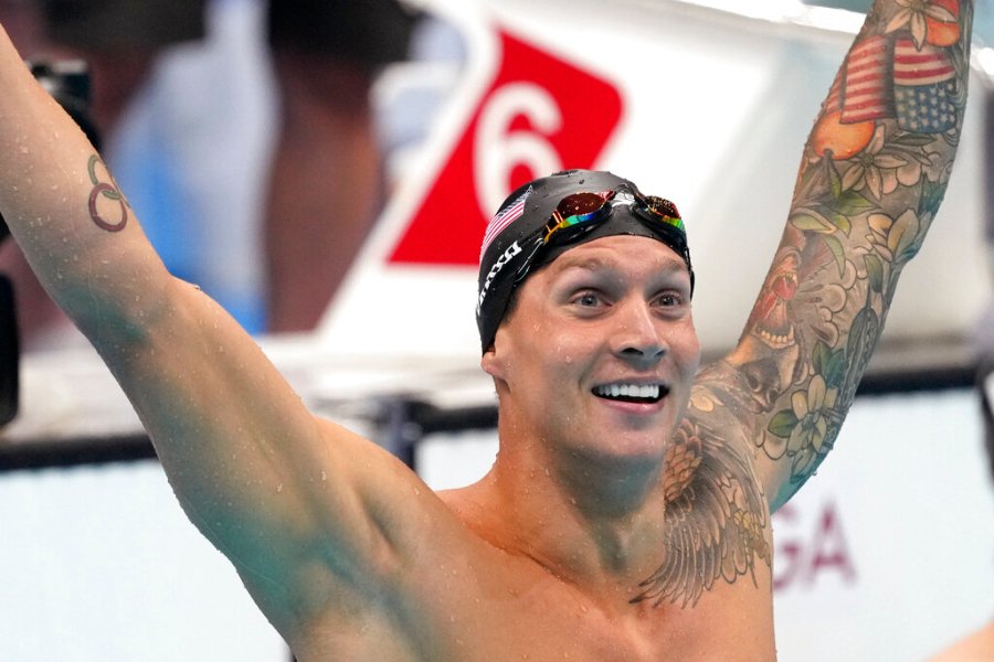 Caeleb Dressel of the United States celebrates winning the men's 100-meter freestyle final at the 2020 Summer Olympics, Thursday, July 29, 2021, in Tokyo, Japan. (AP Photo/Matthias Schrader)