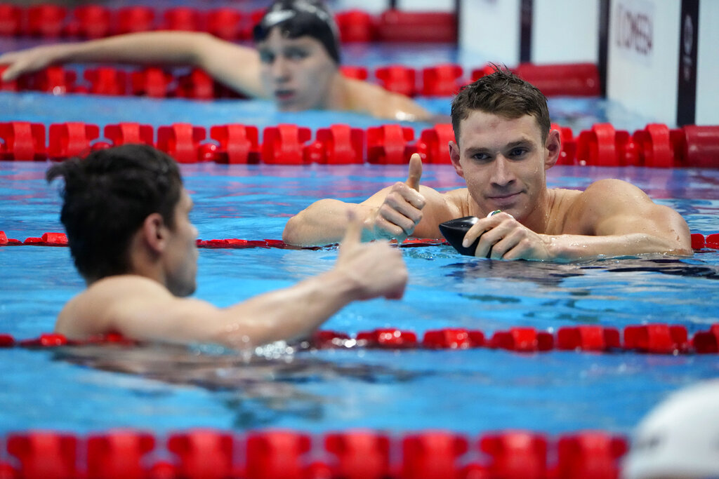 The United States' Ryan Murphy, right, gives a thumbs up to Evgeny Rylov, of Russian Olympic Committee, after Rylov won the men's 200-meter backstroke final at the 2020 Summer Olympics, Friday, July 30, 2021, in Tokyo, Japan. (AP Photo/David Goldman)