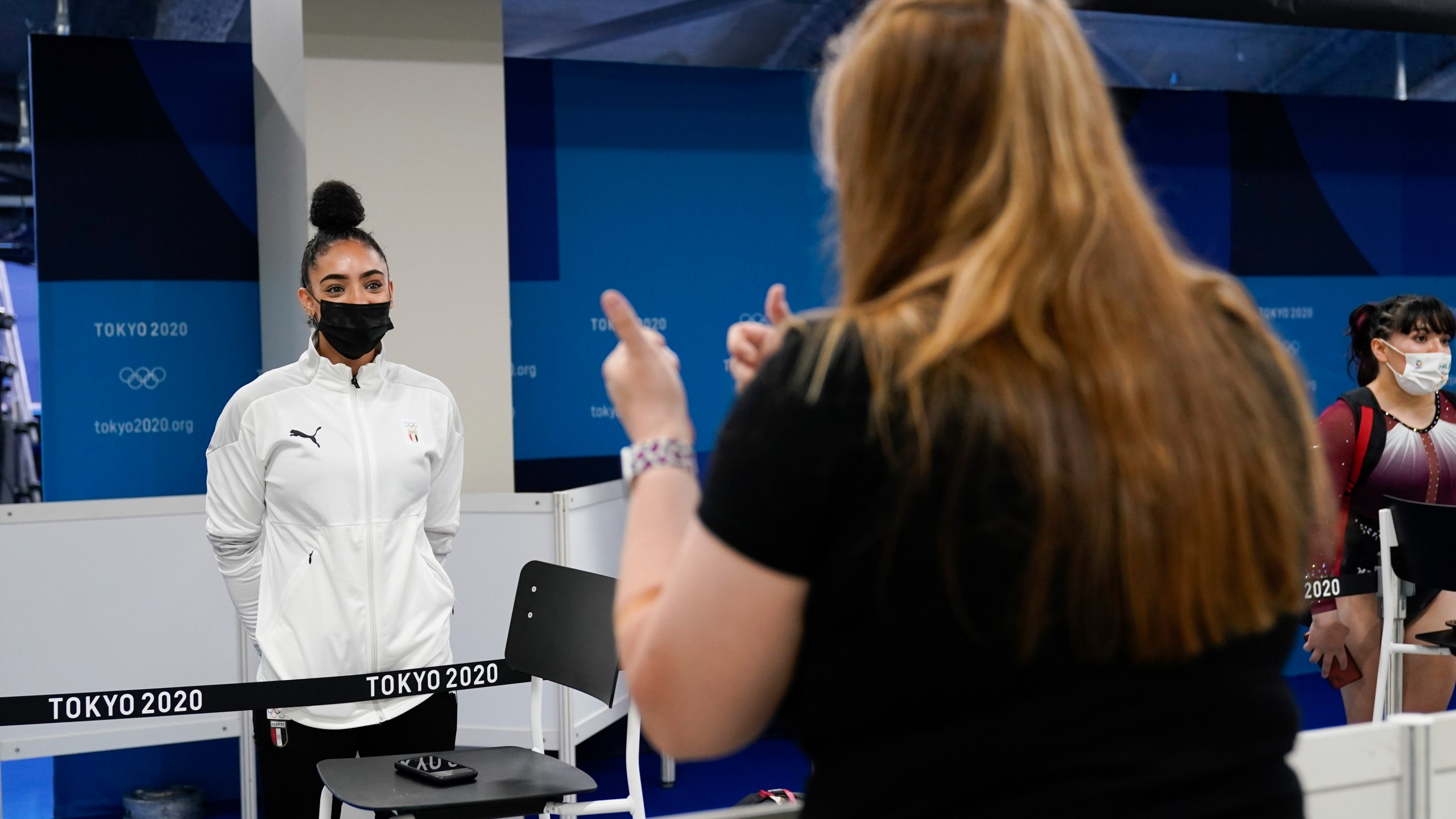 Jessica O'Beirne, right, interviews Mandy Mohamed, an artistic gymnast from Egypt, after the women's artistic gymnastic qualifications at the 2020 Summer Olympics, Monday, July 26, 2021, in Tokyo, Japan. (AP Photo/Ashley Landis)