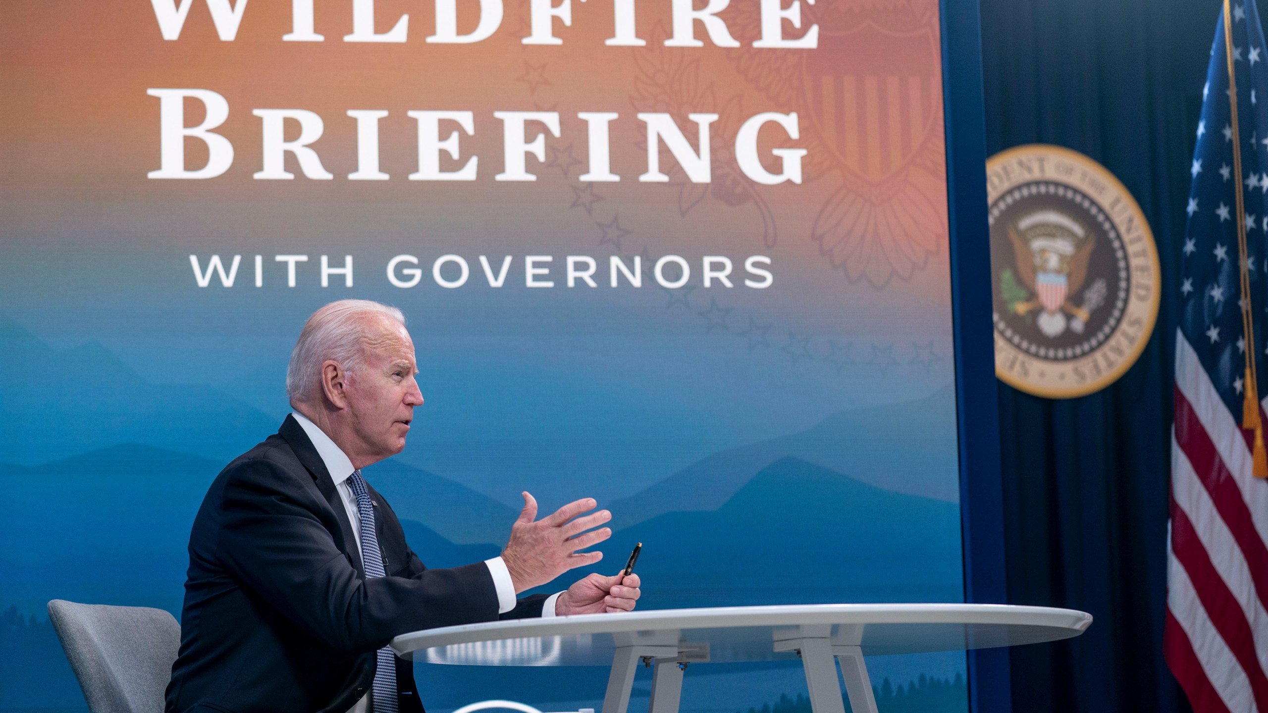 President Joe Biden speaks during a meeting with governors to discuss ongoing efforts to strengthen wildfire prevention, preparedness and response efforts, and hear firsthand about the ongoing impacts of the 2021 wildfire season in the South Court Auditorium in the Eisenhower Executive Office Building on the White House Campus in Washington, Friday, July 30, 2021. (AP Photo/Andrew Harnik)