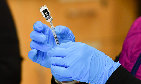 A syringe with a dose of the Pfizer COVID-19 vaccine in Anchorage on March 19, 2021. (FREDERIC J. BROWN/AFP via Getty Images)