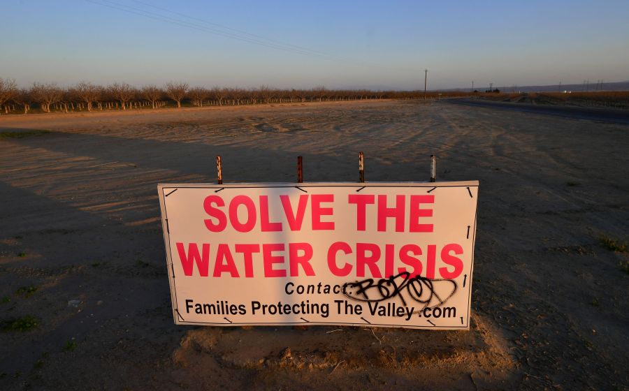 A sign calls for solving California's water crisis on the outskirts of Buttonwillow in California's Kern County on April 2, 2021, one of the top agriculture producing counties in the San Joaquin Valley where dairy, grapes, almonds, strawberries, and pistachios contribute billions to the economy each year. (FREDERIC J. BROWN/AFP via Getty Images)