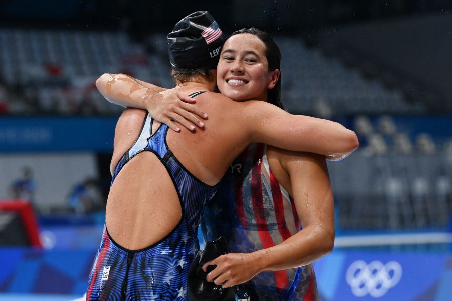 First placed USA's Katie Ledecky, left, and second placed USA's Erica Sullivan hug after the final of the women's 1500m freestyle swimming event during the Tokyo 2020 Olympic Games at the Tokyo Aquatics Centre on July 28, 2021. (Jonathan Nackstrand / AFP / Getty Images)