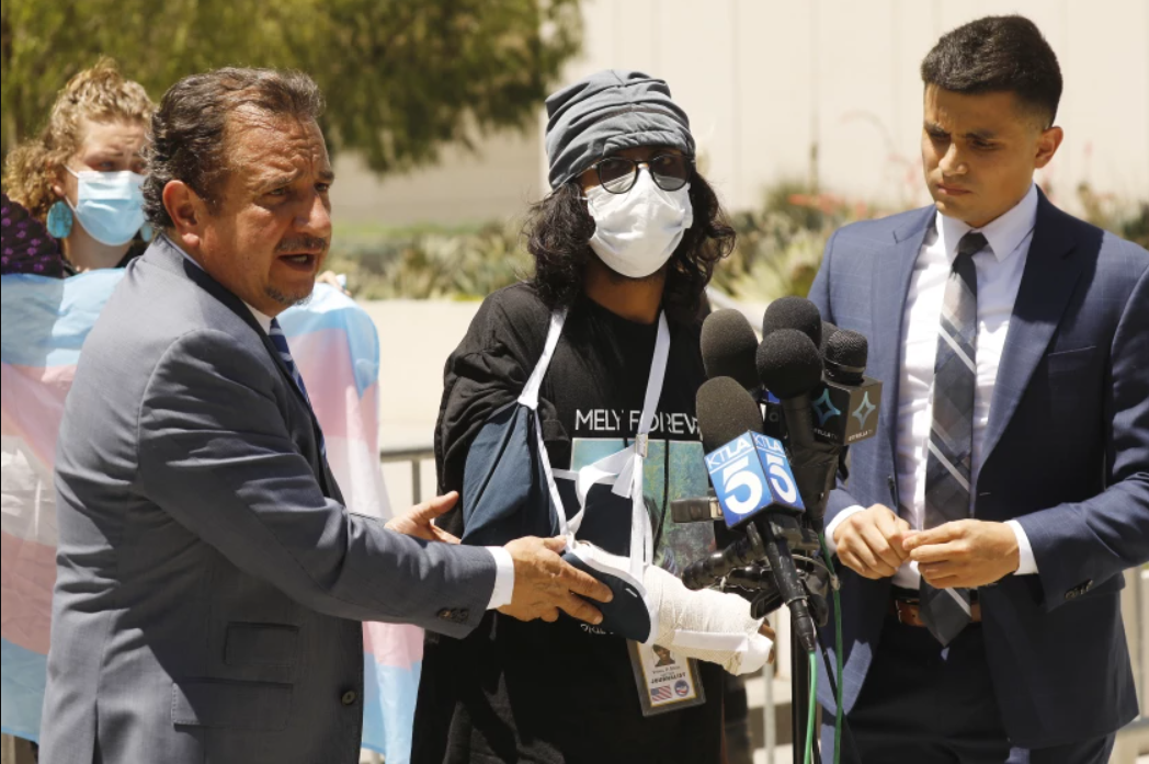 Vishal Singh, center, a documentary filmmaker, alleged he was struck with a baton by a police officer during a protest outside a Westlake spa on July 17, 2021. (Al Seib/Los Angeles Times)