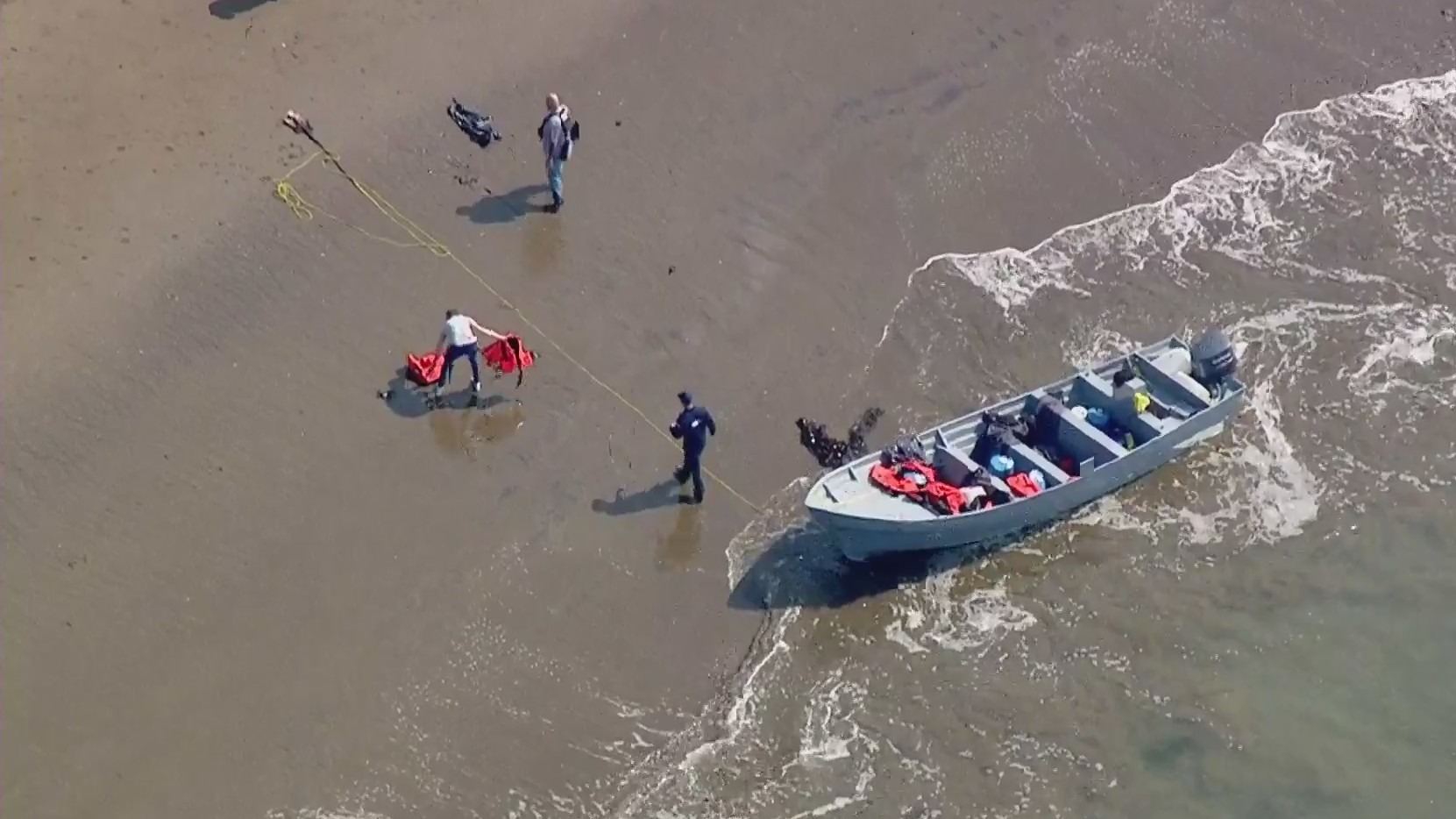 A still image from Sky5 shows the panga boat on the Smuggler's Cove shore in the Palos Verdes area on July 15, 2021. (KTLA)