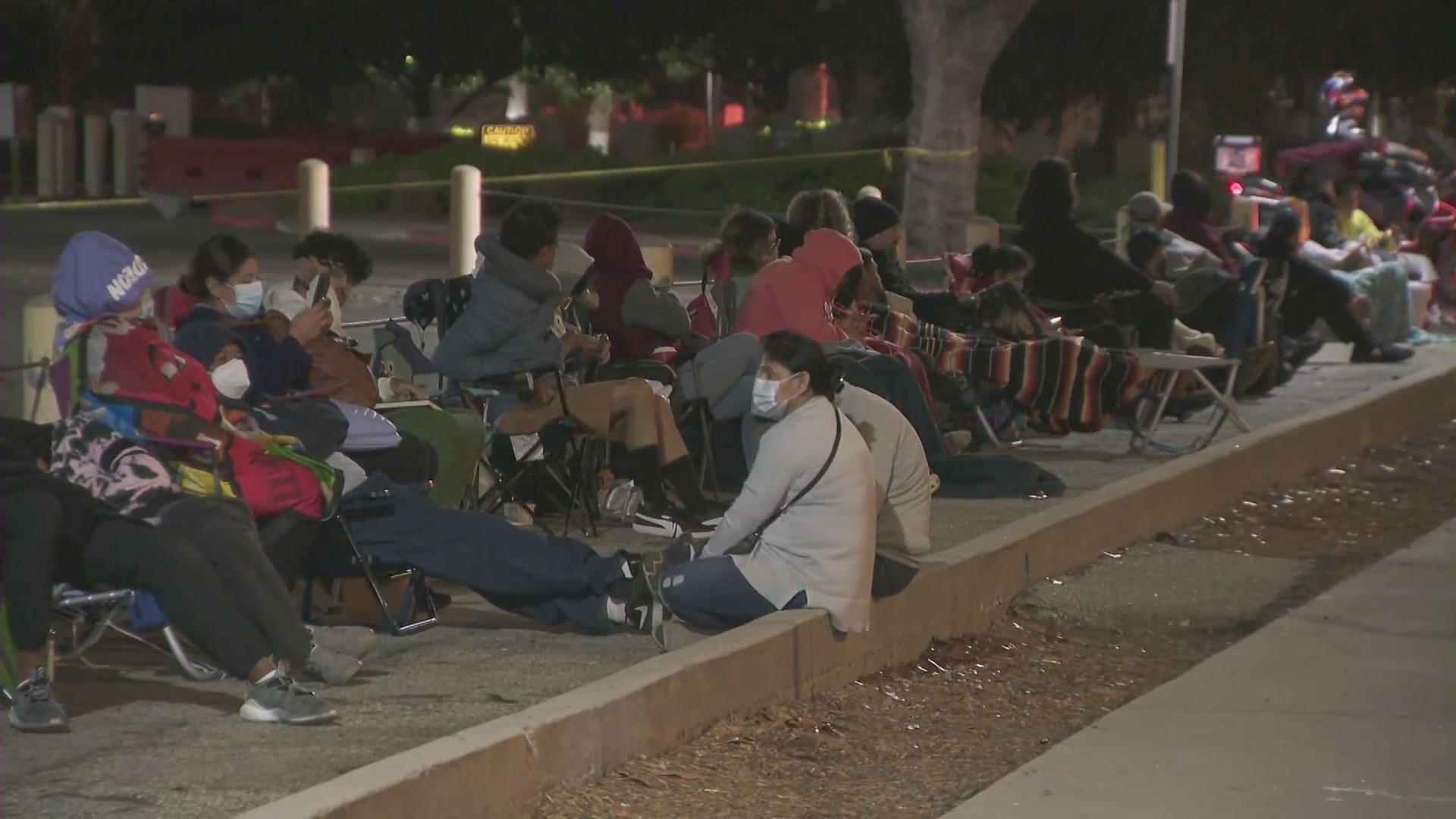 People wait outside the Federal Building in West Los Angeles to renew their passports on July 23, 2021. (KTLA)