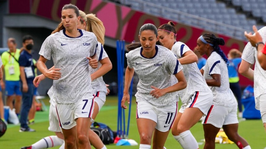 United States players warm up before a women's soccer match against Sweden at the 2020 Summer Olympics, Wednesday, July 21, 2021, in Tokyo. (AP Photo/Ricardo Mazalan)