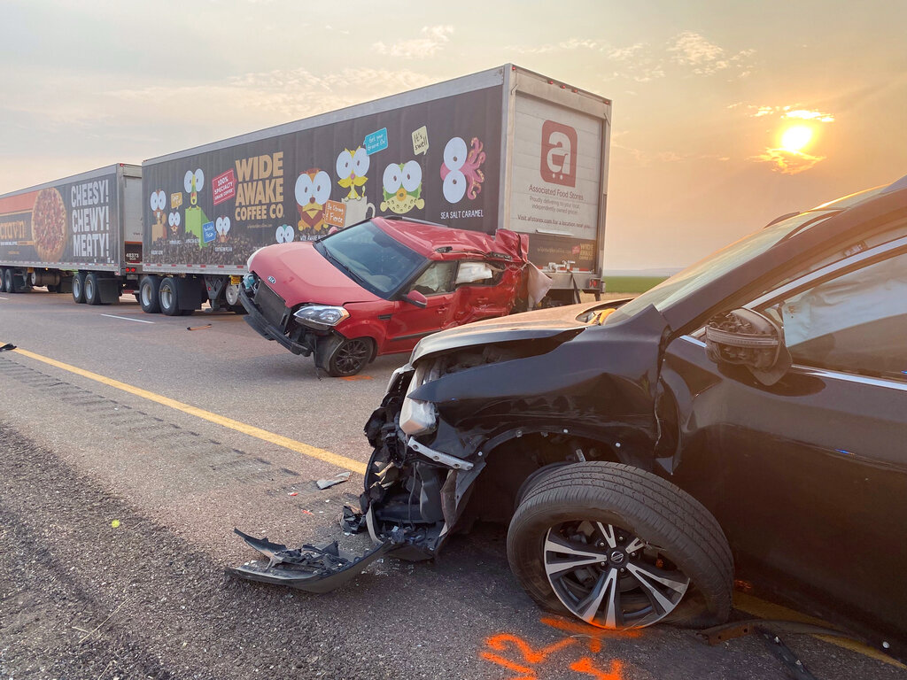 This photo provided by the Utah Highway Patrol shows several of the vehicles involved in a fatal pileup, Sunday, July 25, 2021, on Interstate 15 in Millard County, near the town of Kanosh, Utah. (Utah Highway Patrol via AP)