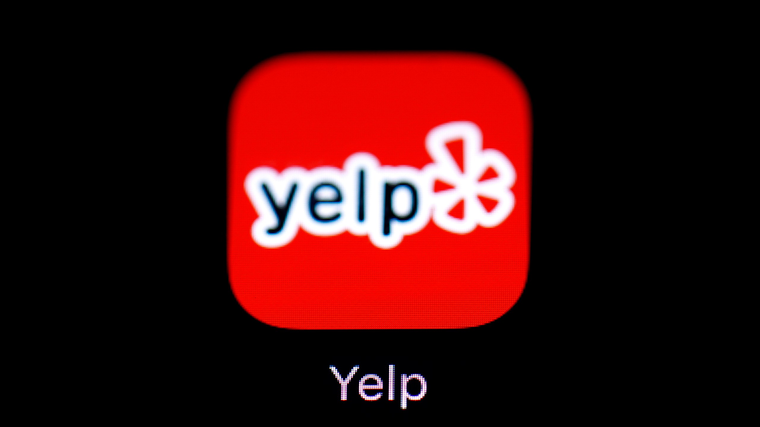 This March 19, 2018, file photo shows the Yelp app on an iPad in Baltimore. (AP Photo/Patrick Semansky, File)