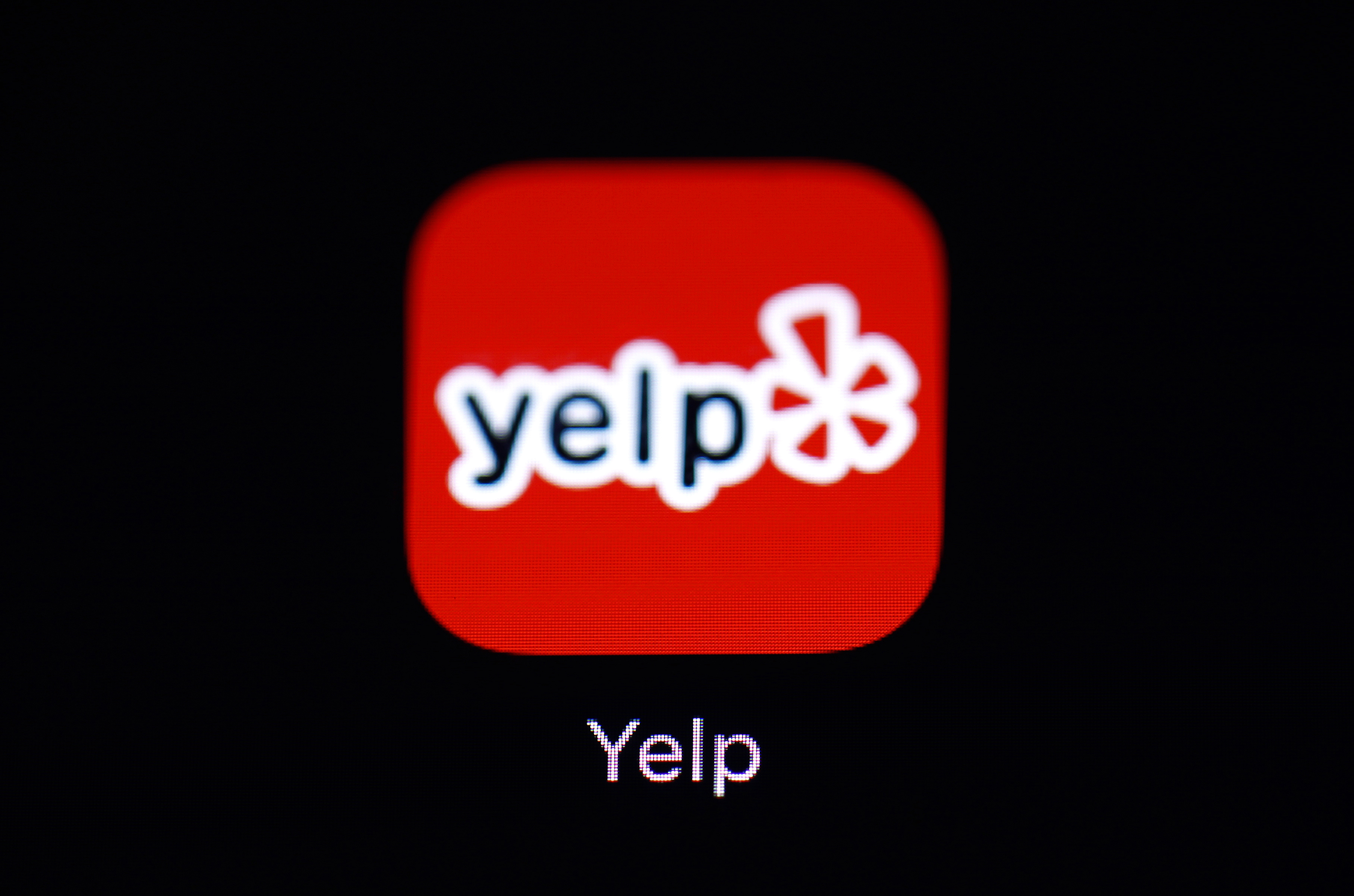 This March 19, 2018, file photo shows the Yelp app on an iPad in Baltimore. (AP Photo/Patrick Semansky, File)