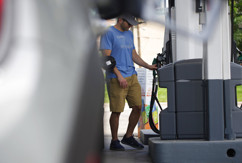 A motorist prepares to fill up the gasoline tank on his vehicle at a Shell station Thursday, July 22, 2021, in southeast Denver. (AP Photo/David Zalubowski)