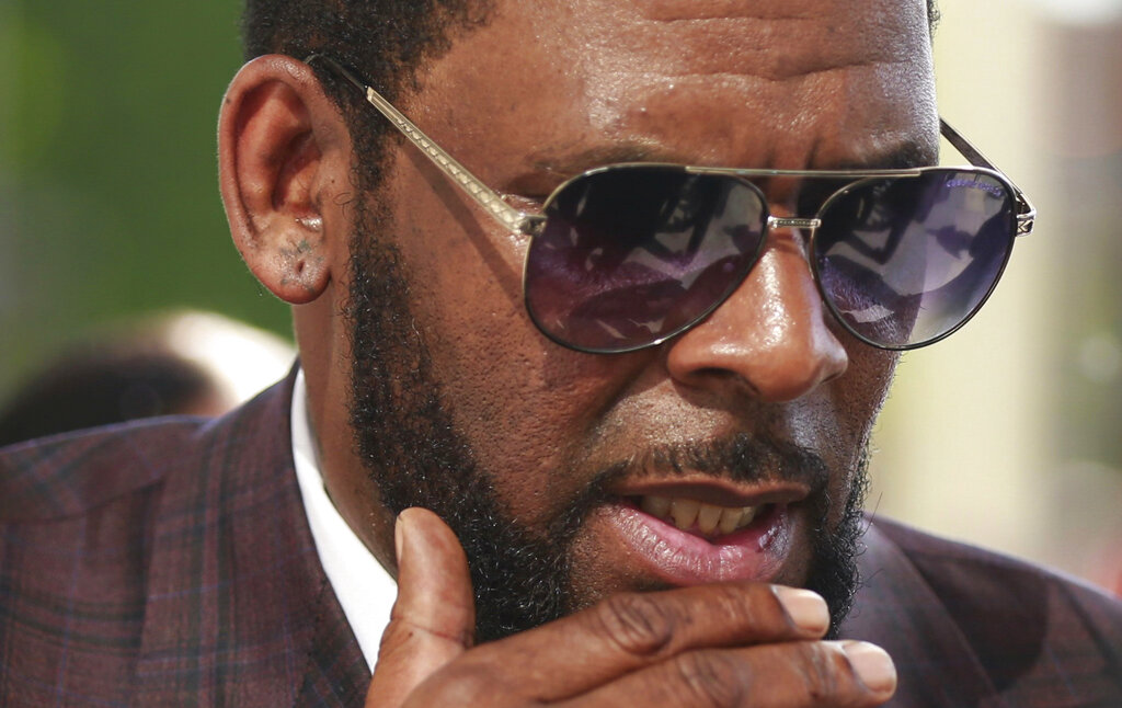 This photo from Wednesday June 26, 2019, shows R&B singer R. Kelly arriving at the Leighton Criminal Court in Chicago for arraignment on sex-related charges. (AP Photo/Amr Alfiky, File)