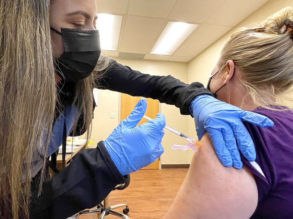 Nurse Jennifer Ulloa administers a COVID-19 vaccine Tuesday, July 27, 2021, at the County's vaccination clinic in Whispering Pines, Calif. (Elias Funez/The Union via AP)