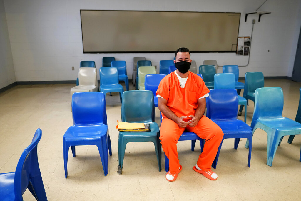 Immigration detainee Alexander Martinez speaks during an interview with The Associated Press inside the Winn Correctional Center in Winnfield, La., Friday, July 30, 2021. (AP Photo/Gerald Herbert)