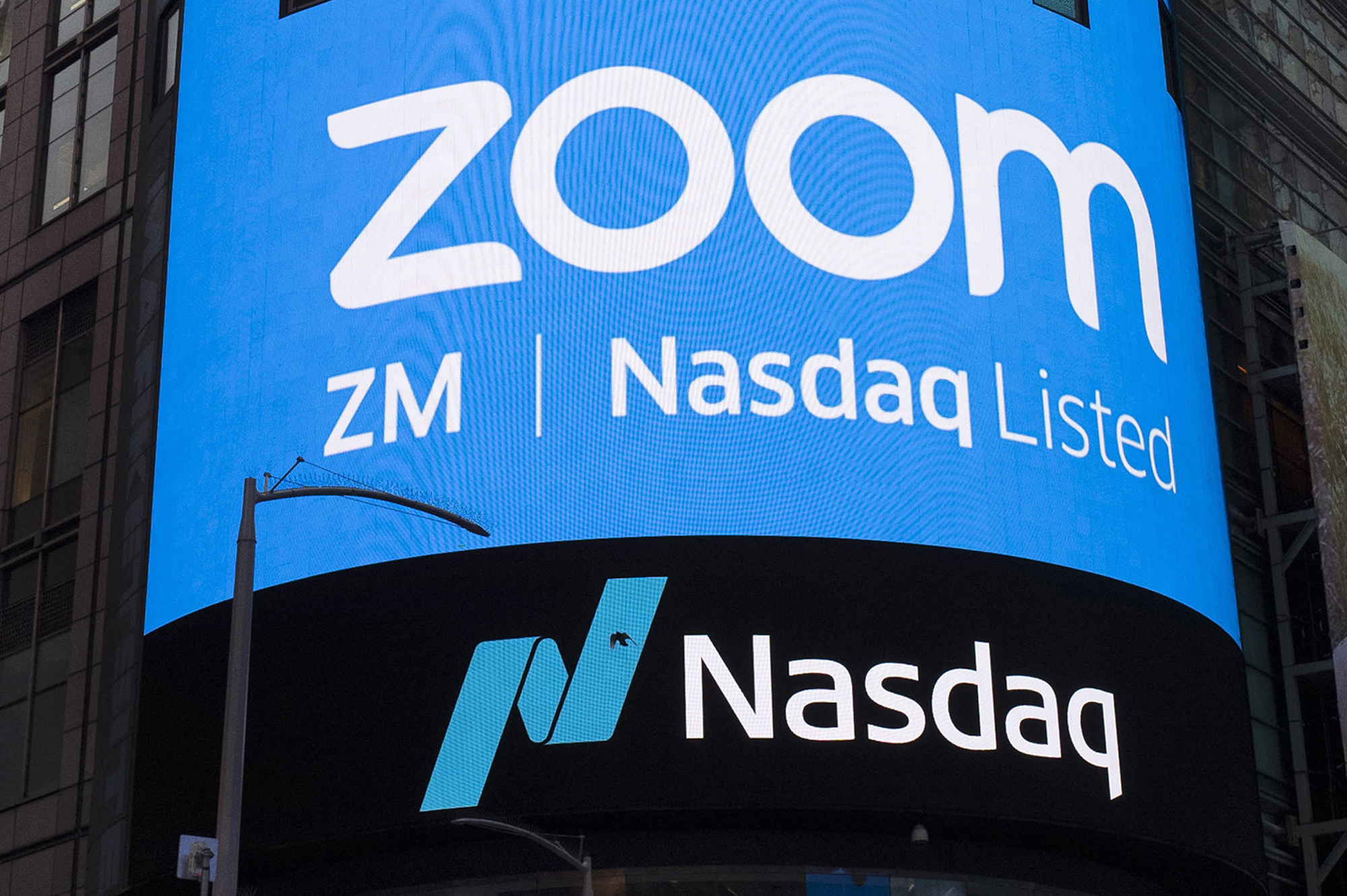 This April 18, 2019, file photo shows a sign for Zoom Video Communications ahead of their Nasdaq IPO in New York. (Mark Lennihan/Associated Press)