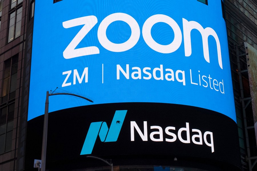 This April 18, 2019, file photo shows a sign for Zoom Video Communications ahead of their Nasdaq IPO in New York. (Mark Lennihan/Associated Press)