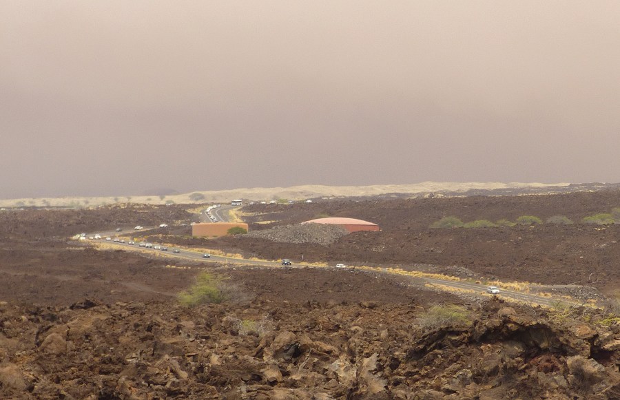 Vehicles are backed up on Waikoloa Road after a mandatory evacuation was ordered as a wildfire approached the Waikoloa Village area of Hawaii, Sunday, Aug. 1, 2021. A second emergency route was later opened to provide residents another way out. (Chelsea Jensen/West Hawaii Today via AP)