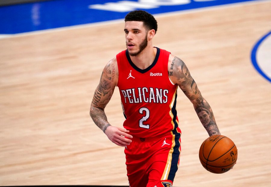 In this Feb. 12, 2021, file photo, New Orleans Pelicans' Lonzo Ball brings the ball up during the team's NBA basketball game against the Dallas Mavericks in Dallas. (AP Photo/Tony Gutierrez, File)