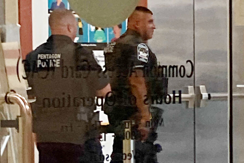 Pentagon police officers walk near the facility’s Metro station, Tuesday, Aug. 3, 2021, at the Pentagon in Washington. (AP Photos/Sagar Meghani)