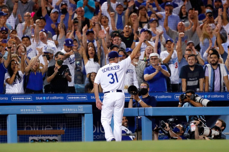 Los Angeles Dodgers starting pitcher Max Scherzer takes a curtain call during the seventh inning of a baseball game against the Houston Astros in Los Angeles, Wednesday, Aug. 4, 2021. (AP Photo/Alex Gallardo)