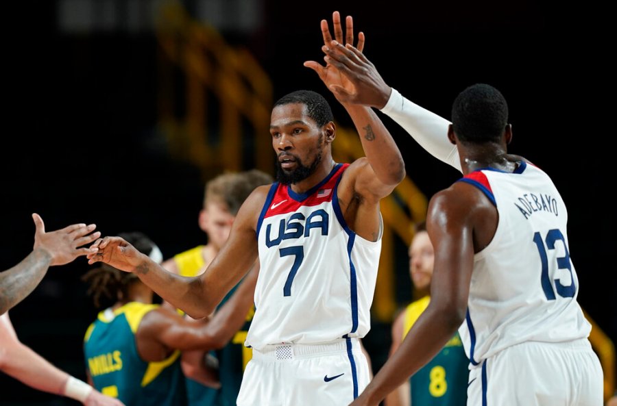 United States's Kevin Durant (7) celebrates with teammates after scoring during men's basketball semifinal game against Australia at the 2020 Summer Olympics, Thursday, Aug. 5, 2021, in Saitama, Japan. (AP Photo/Charlie Neibergall)