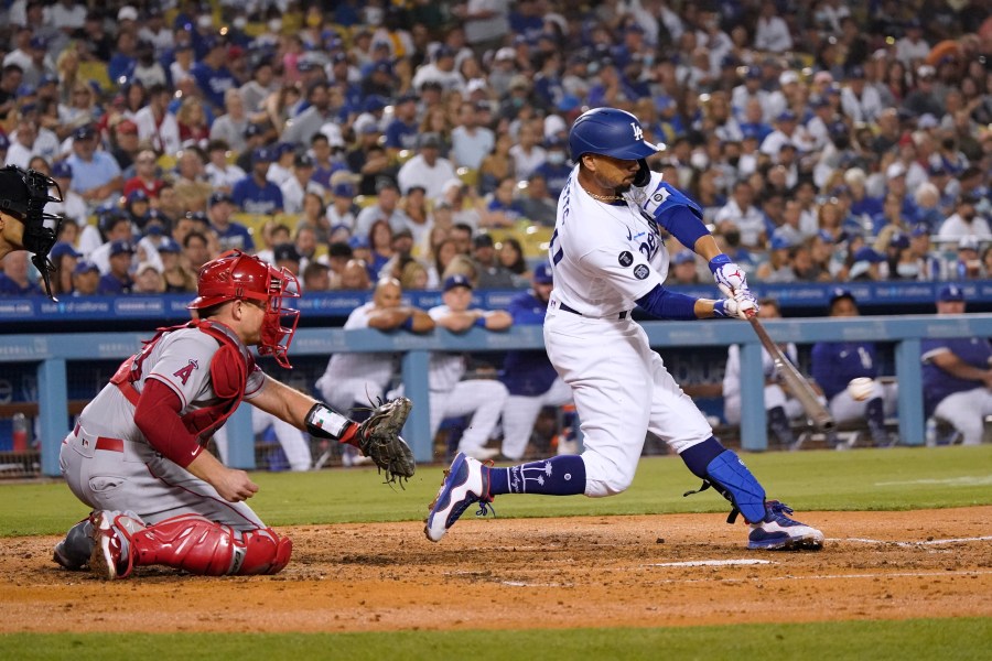 Los Angeles Dodgers' Mookie Betts drives in a run with a single during the fourth inning of the team's baseball game against the Los Angeles Angels on Aug. 6, 2021, in Los Angeles. Betts was taken out of the game with a sore him and was later placed on the injured list. (Marcio Jose Sanchez/Associated Press)