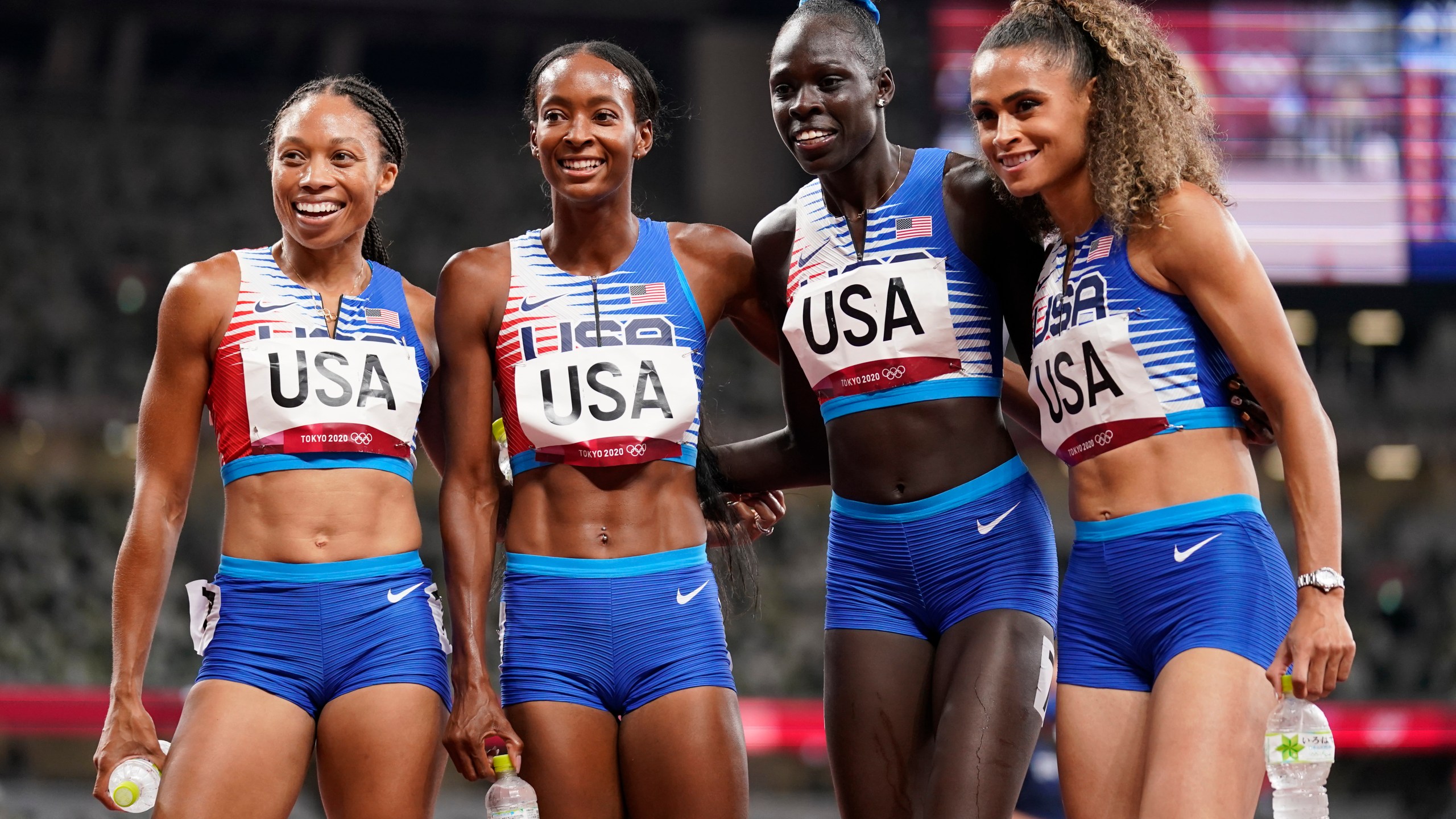 The United States team of Allyson Felix, Dalilah Muhammad, Athing Mu, and Sydney Mclaughlin, from left, celebrate winning the gold medal in the final of the women's 4 x 400-meter relay at the 2020 Summer Olympics, Saturday, Aug. 7, 2021, in Tokyo, Japan. (AP Photo/Charlie Riedel)